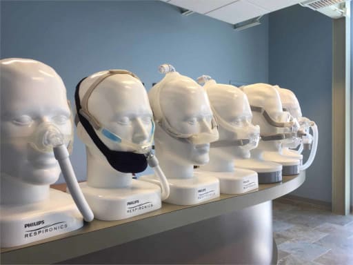 Image of mannequins with CPAP masks on.